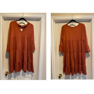 Soft tiered rust colored ruffle swing dress